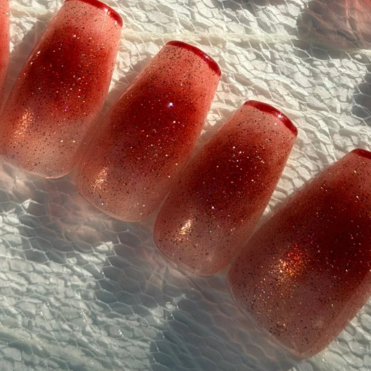 Red Cheek press-on nails, close-up of the hand-painted detail